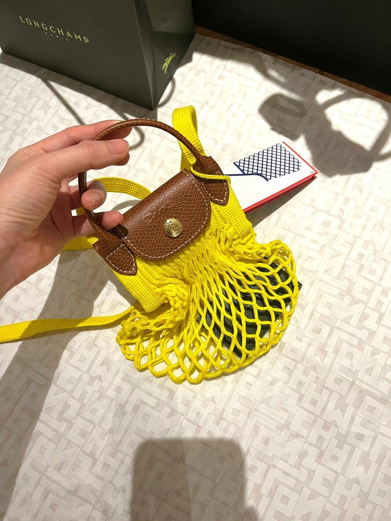 Longchamp net bag .Size:S:18X17cm,L:38x31cm.